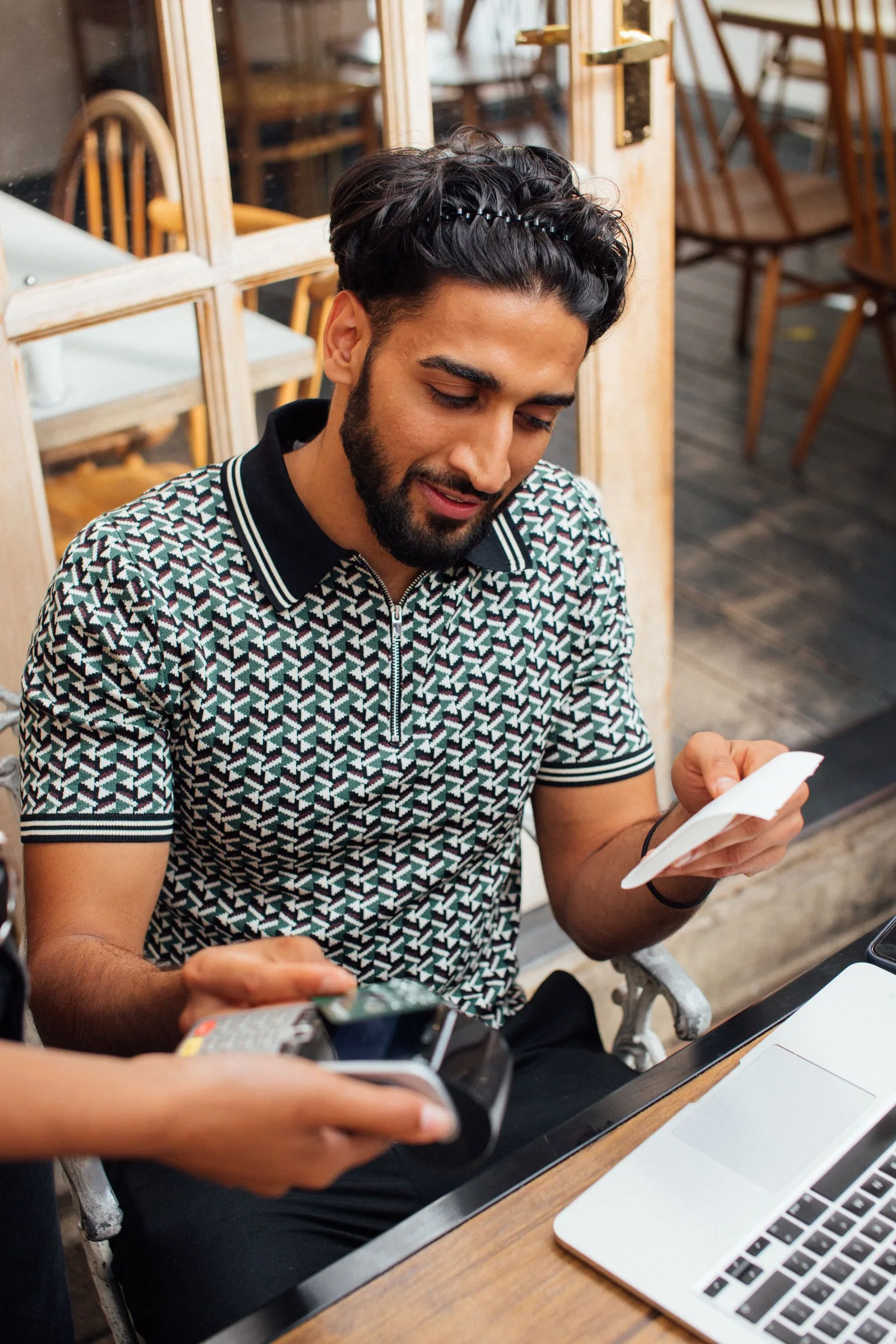 A customer checking a purchase receipt