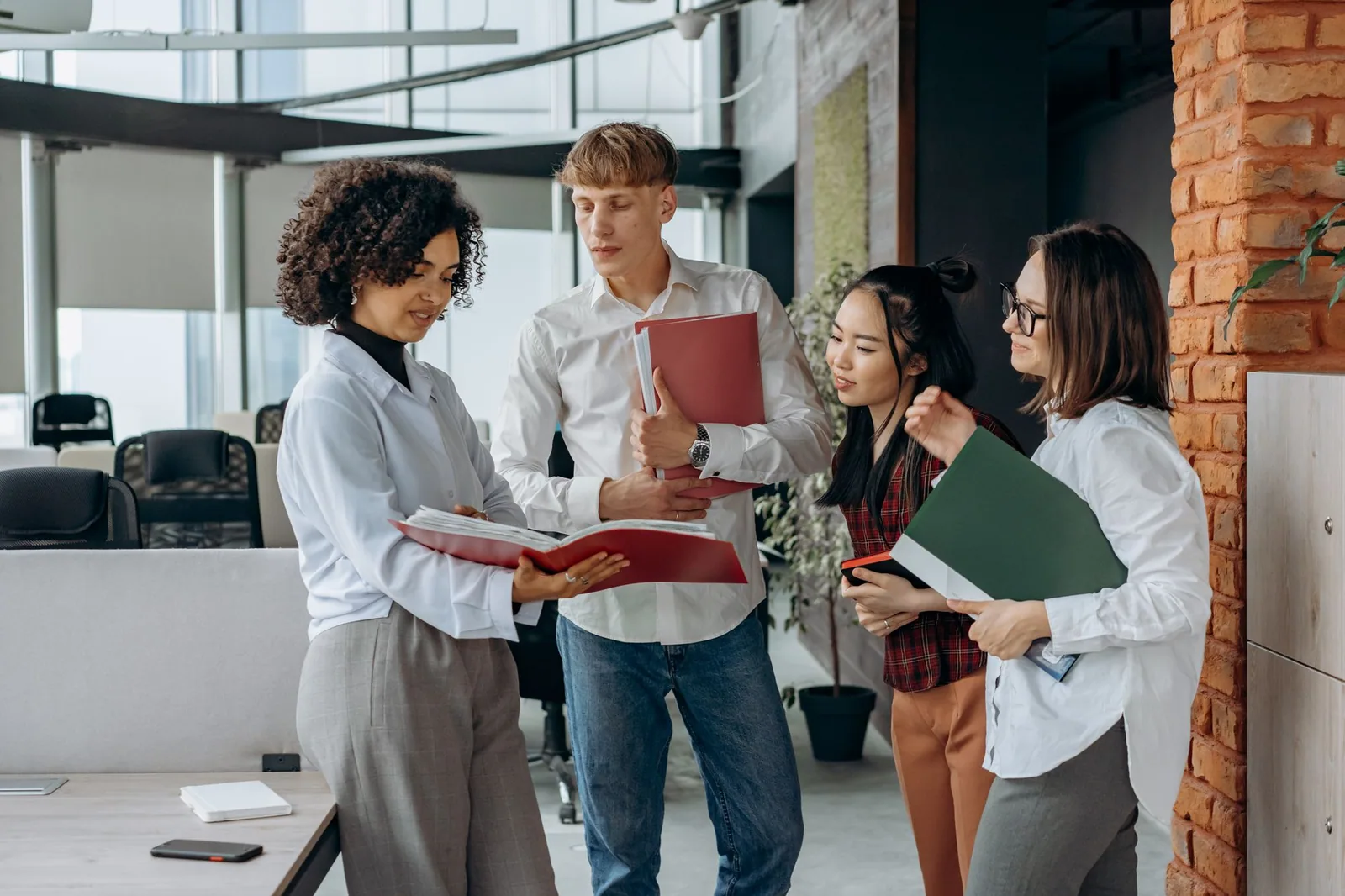 An office team reviewing documents together