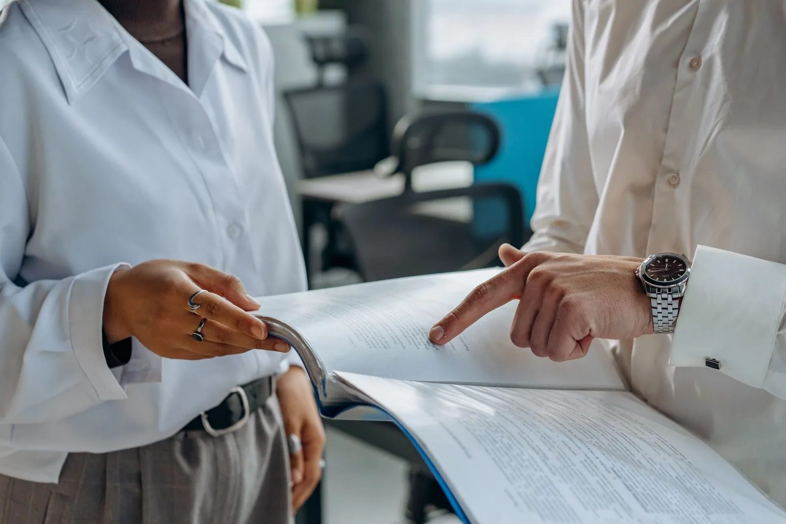 Colleagues reviewing a financial report